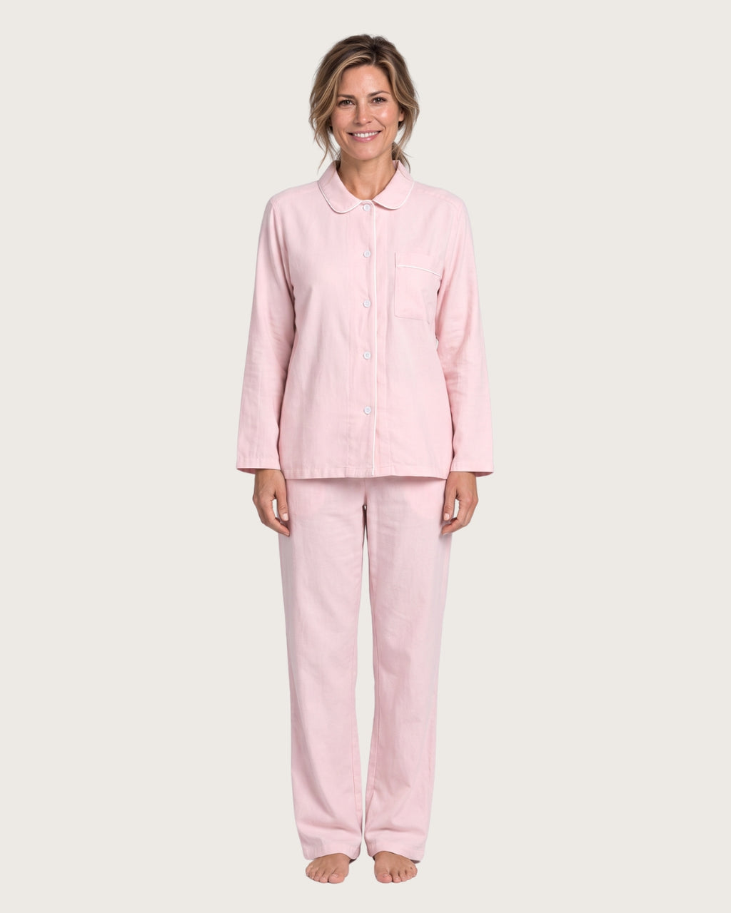 Amber women’s pink cotton pajama set with white piping, front view