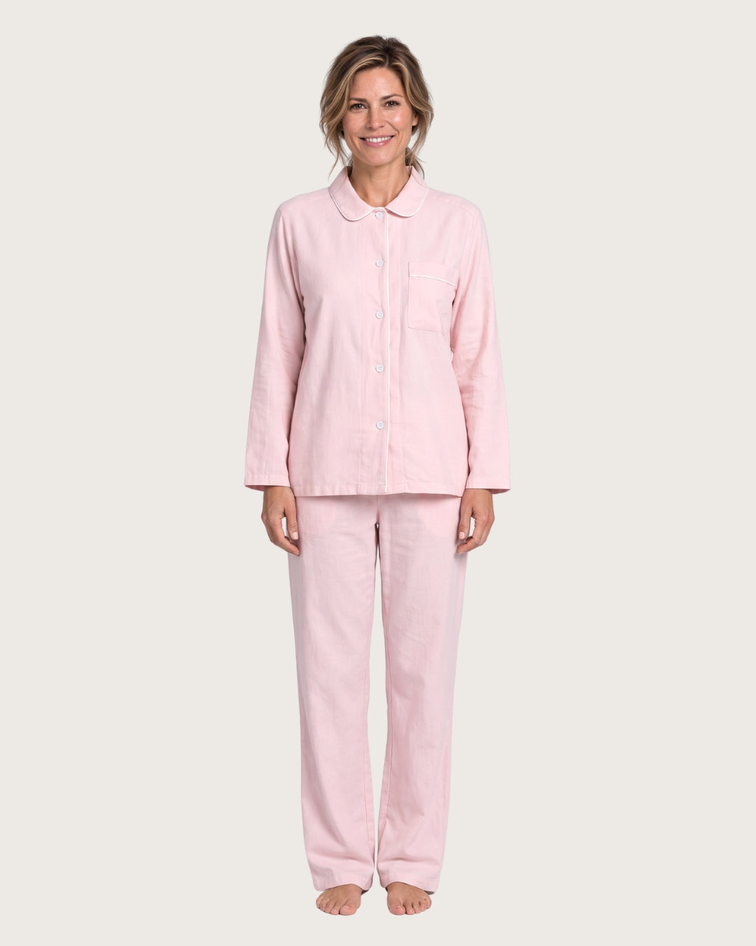 Amber women’s pink cotton pajama set with white piping, front view