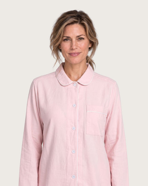Close-up of Amber pink cotton pajama top with rounded collar, buttons and chest pocket