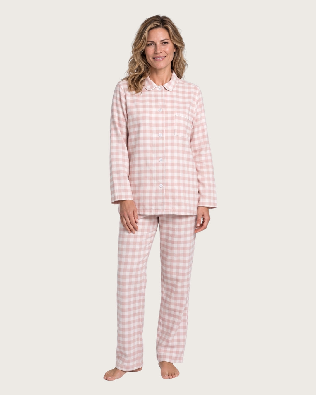 Woman wearing the Faye pink plaid cotton flannel pajama set, full-body front view