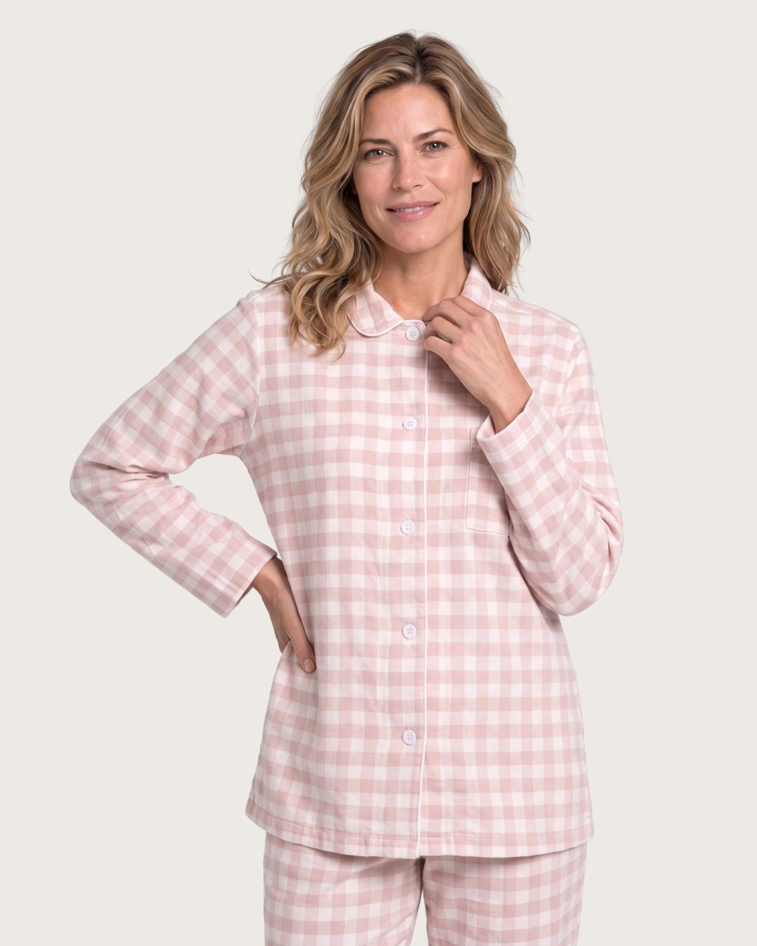 Woman wearing the Faye pink plaid flannel pajama top, upper-body studio view