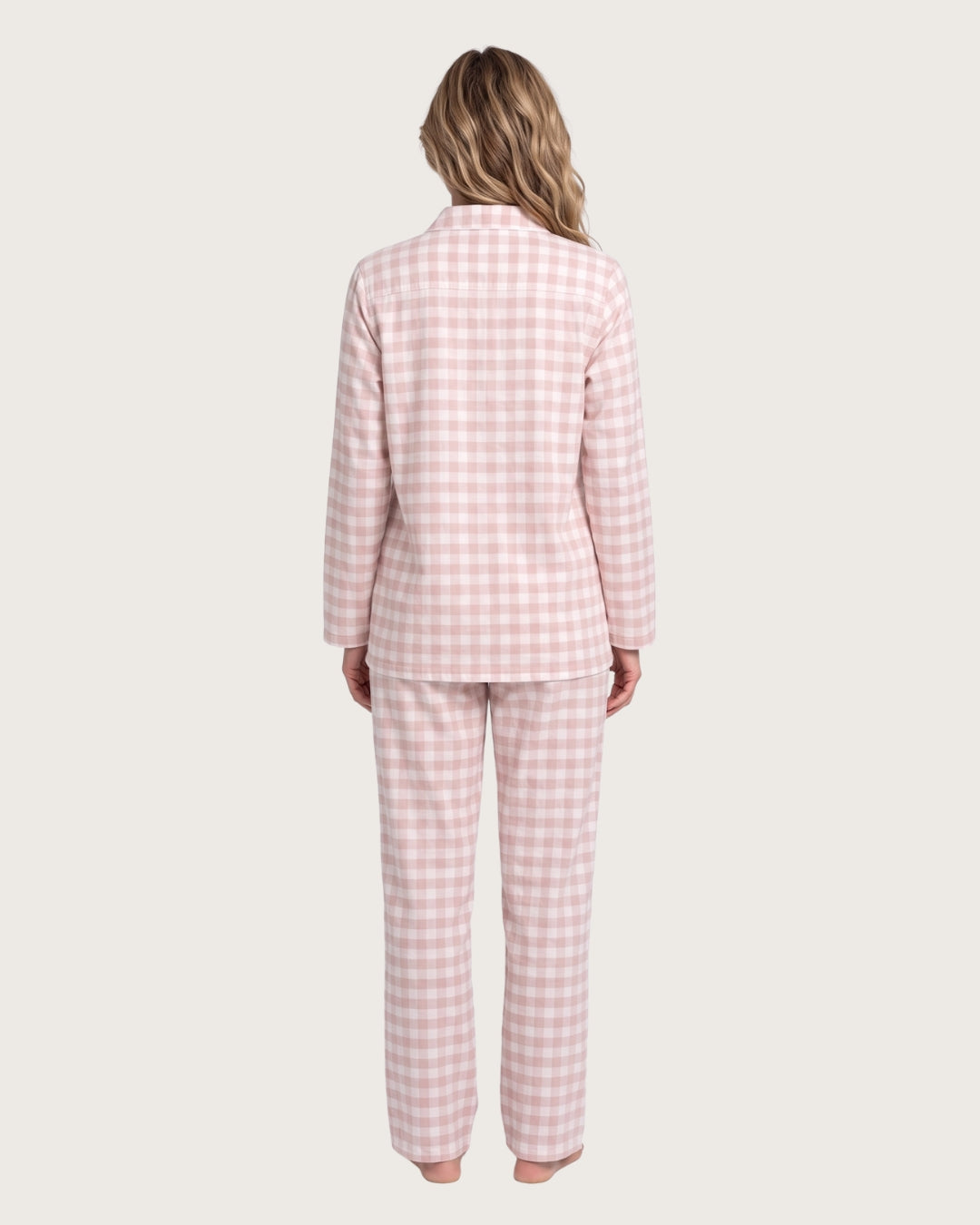 Woman wearing the Faye pink plaid cotton pajamas, full-body back view