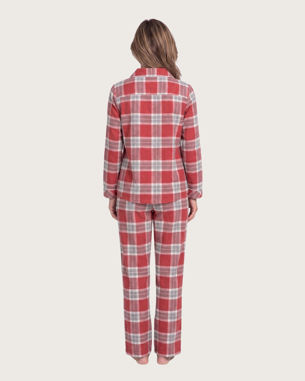 Woman wearing the Rowan red plaid cotton flannel pajama set, full-body back view