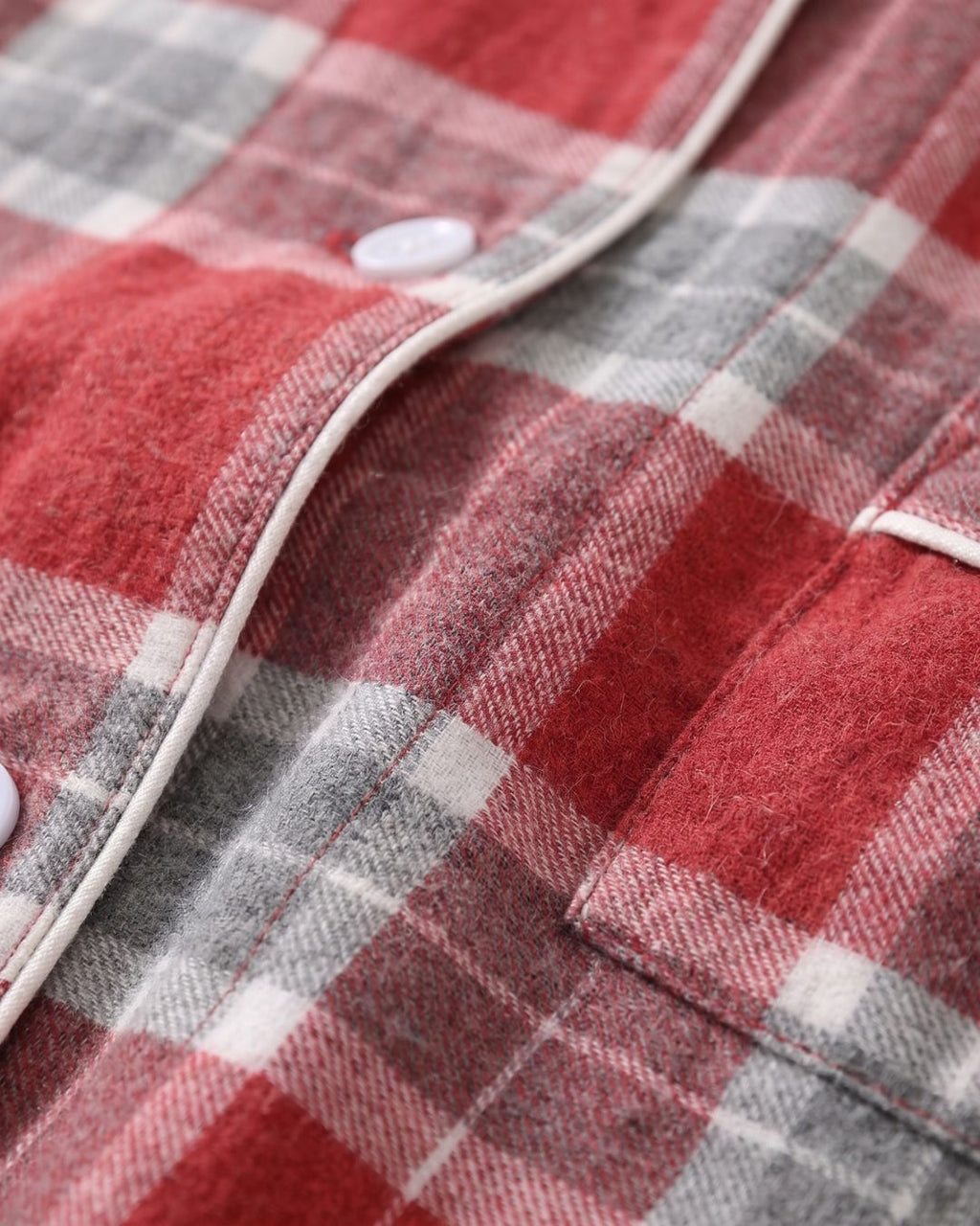 Close-up of Rowan red plaid cotton fabric and button-front pajama top