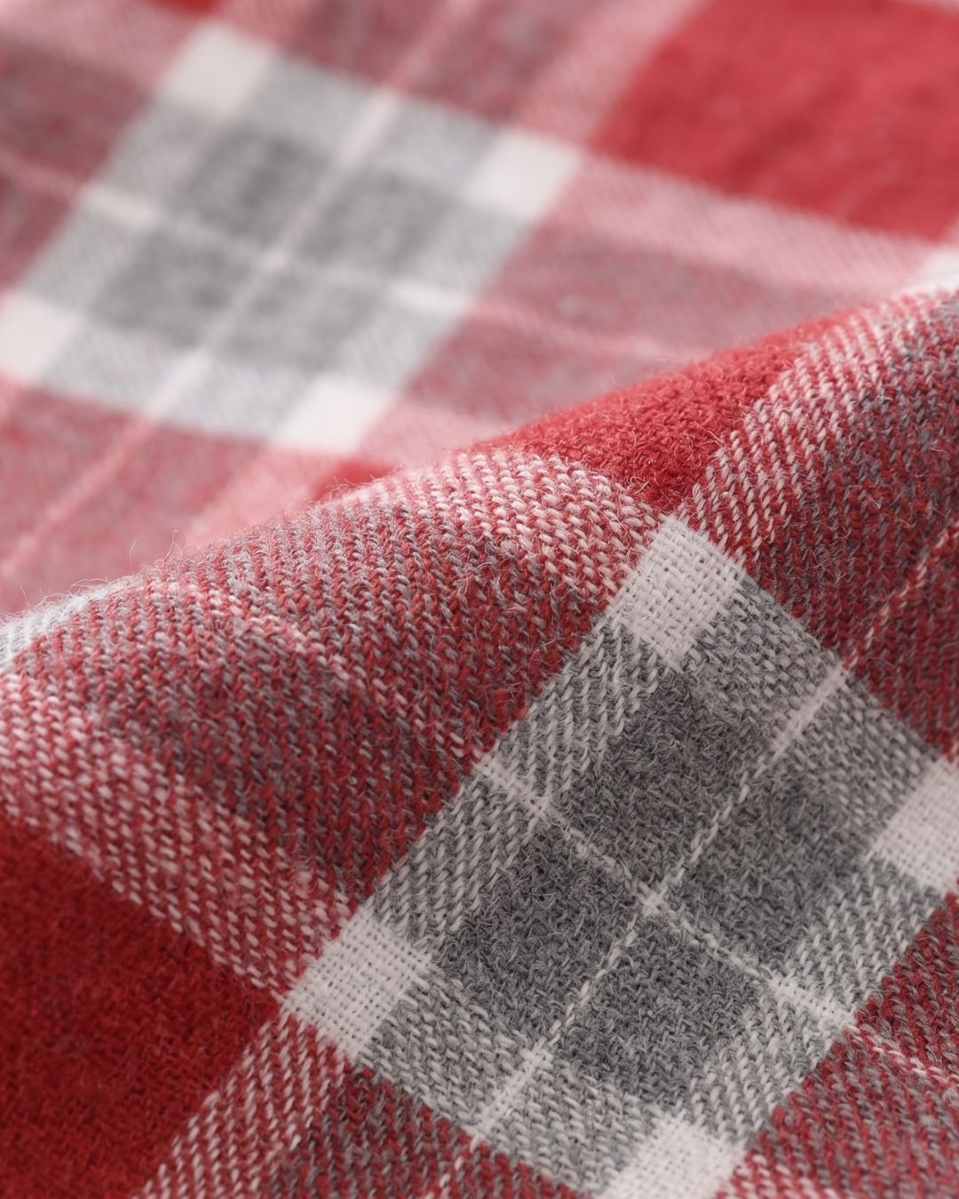 Close-up of Rowan red plaid cotton fabric pajama top