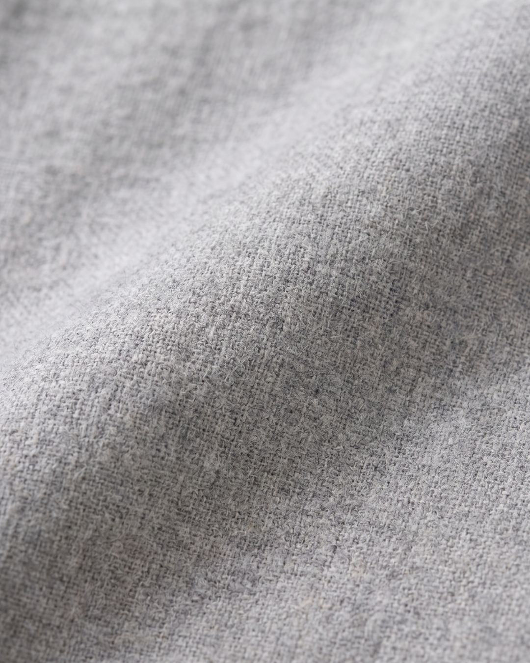 Close-up of soft gray cotton fabric texture on Sage pajama set